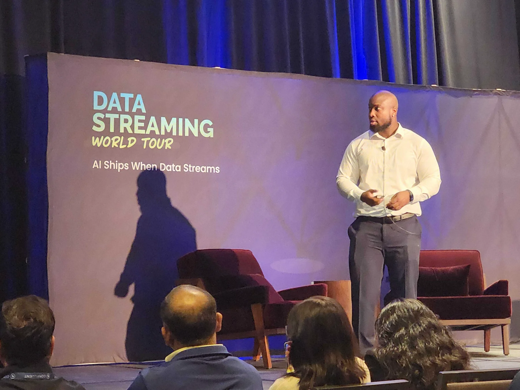 Niyi Odumosu speaking on stage at the Data Streaming World Tour